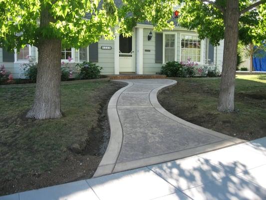 My beautiful new walkway! Can't stop looking at it. Sidewalk great too!  Judy A