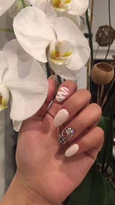 Almond artificial nails and design by Niko.