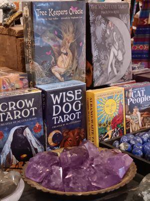 Polished gemstones and assortment of tarot cards