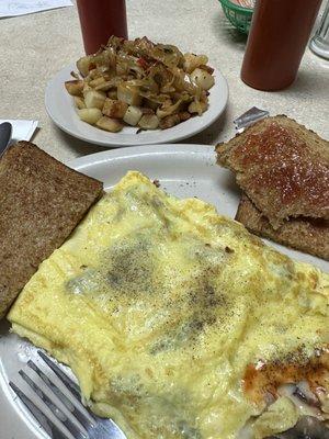 Mushroom and cheese omelette with side of home fries.