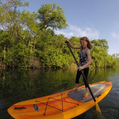 girl on stand up paddle board