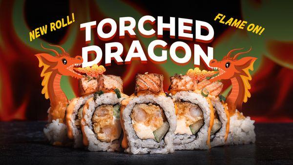 Our newest and most popular roll! Shrimp tempura and cream cheese inside, topped with torched salmon, spicy mayo, and sweet soy sauce. Yum!!