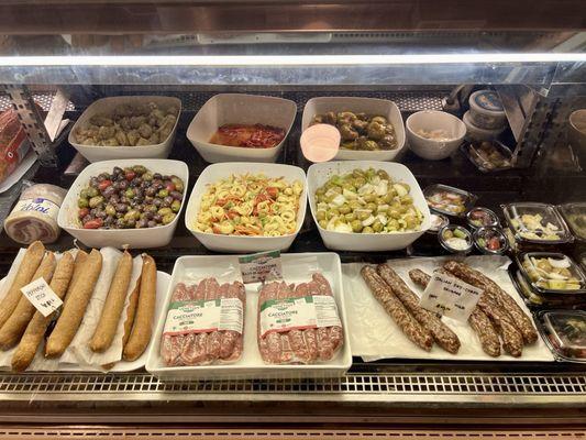 Sausages and salads in the deli case