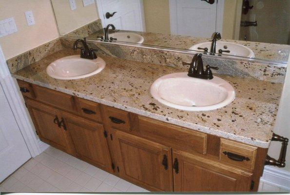 Double bowl sinks for master bathroom all in granite.