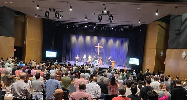 Sunday morning worship service in the New Canaan High School auditorium