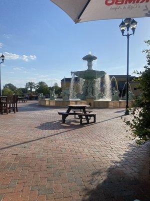 Outside seating with a view of the courtyard fountain.