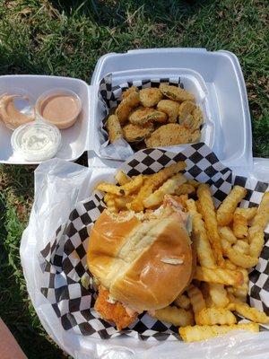 Chicken sandwich, fries and fried pickles