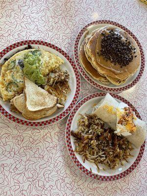 Giant stack of Buckeye Pancakes, the smothered burrito sub vegan chorizo, egg white omelette!