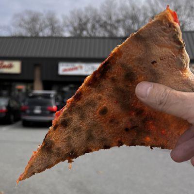 The underside of a choice slice. Crisp, browned, not burnt, not greasy.