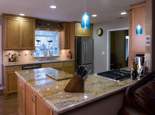 Kitchen Remodel with: hanging pendant lighting, recessed lighting, and under cabinet lighting.