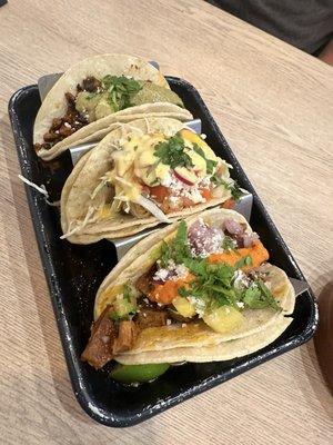 Chorizo, cod and al pastor tacos