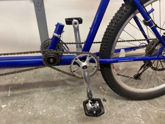 Shimano single sided SPD peddles to keep his feet on the bike. (a must have for him with his CP to keep his feet on the peddles)