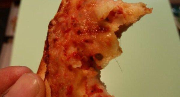 Female pube in pizza