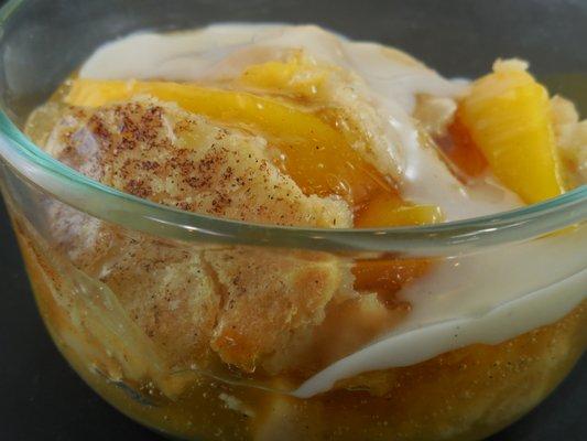 Peach cobbler with Grandma Meyers' recipe cobbler sauce.