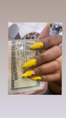 Almond nails with yellow acrylic and a design I brought to the table.... literally! Fancy Nancy executes once again!