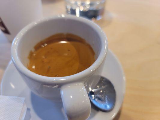 Perfect espresso pull also served with filtered water.  Excellent new local coffee shop that actually took Starbucks place!