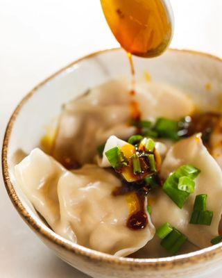 Pork dumplings in chili oil