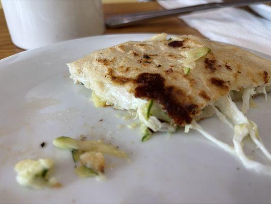 Best item we ordered. Cheese and squash pupusa with sale and tomato juice.