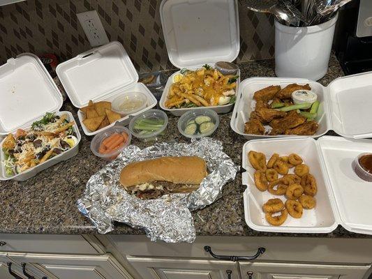 Steak and chicken salad, dry Cajun wings, fried hot pepper rings a Philly steak sandwich and hummus and veges