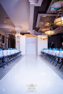 Runway, wall flats, chairs and lighting rental for fashion event