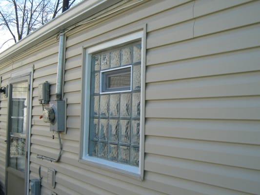 Glass block bathroom window with air vent