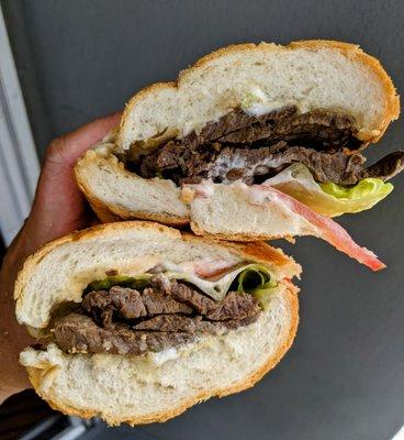 Steak sandwich with chimichurri lettuce tomato and mayo