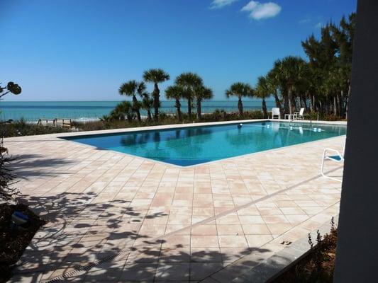 White Pearl pool plaster; American Pavers Biscayne pavers in Englewood