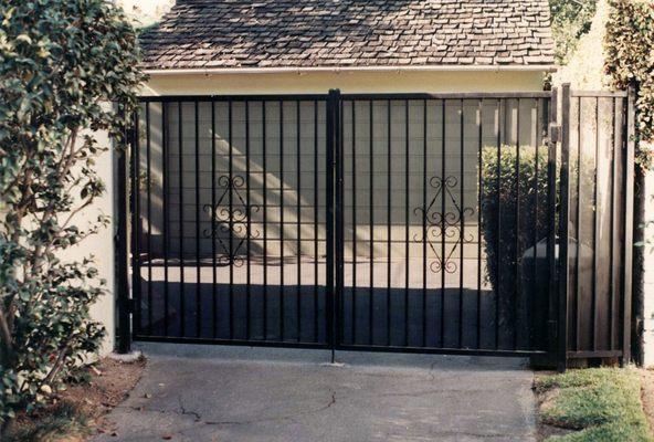 Iron double gates with perforated metal