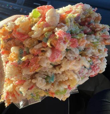 Giant rice crispy treat made out of Fruity Pebbles