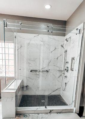 Glass header for sliding shower doors