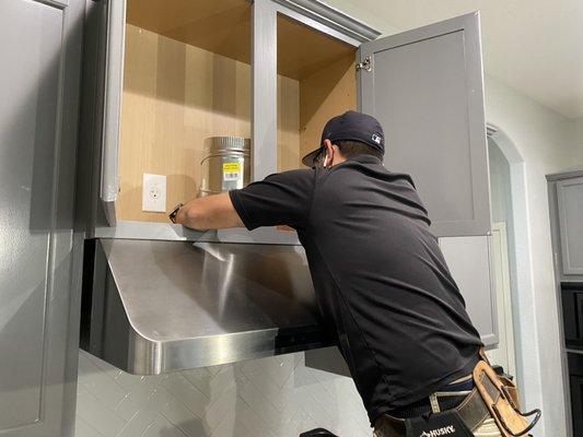 Hanging, ducting, and venting a kitchen range hood