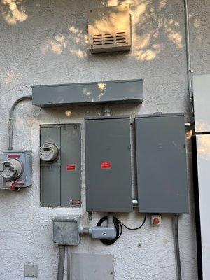 New 200A flush mounted main service panel installed with a hot gutter box and sub panel.