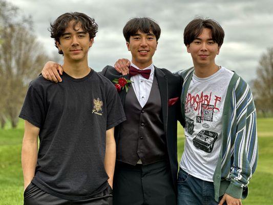 Our son in his Men's Wearhouse tuxedo, posing with his brothers.