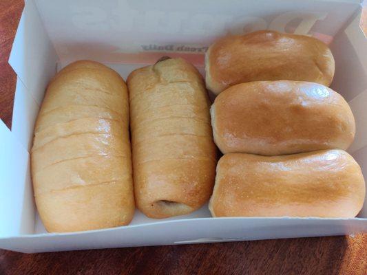 Kolaches!  2 big on the left are boudain, and assorted sausage and ham and cheese on right.