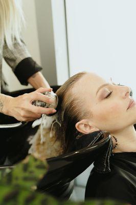 Enjoy a peaceful shampoo experience during your hair extension experience.