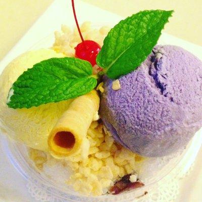 Halo Halo is a Filipino dessert with purple yam ice cream, flan, sweet red beans (azuki), young coconut, sweet corn, and diced bananas