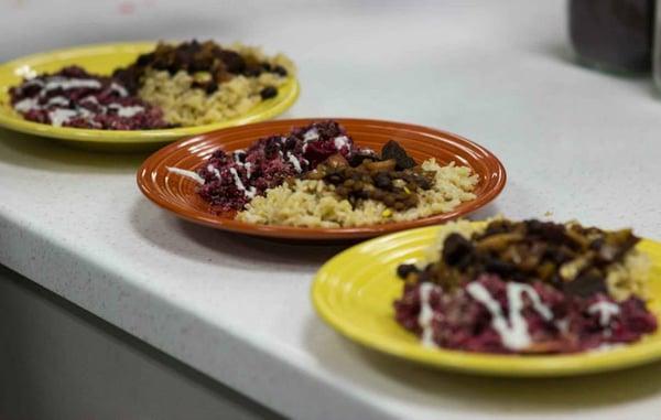 Rad beets bowl with yogurt tahini dressing and stew over rice at the Grand Opening