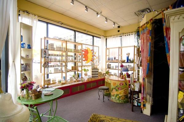 Our boutique is filled with beautiful artwork created by local artists. Note the desk, curtain, stained glass.....