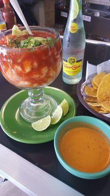 Ceviche. Spicy salsa. Chip's. Topo Chico.