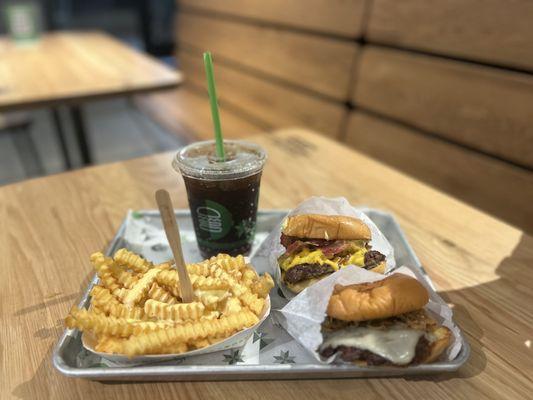 Black Truffle Burger, Avocado Burger, Cheese Fries, and a small coke