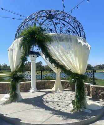 Tropical greenery swag for ceremony dome