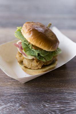 Southern Fried Chicken Sandwich-fried chicken thigh, provolone cheese, pickled onion, lettuce, pickles and carolina peach mustard bbq sauce