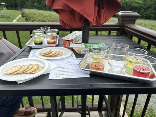 Wine sampling on the left, mead, sampling on the right, and cheese and crackers bought in the house.