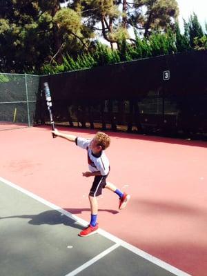 Westwood Tennis Center Junior Crushing a Serve!