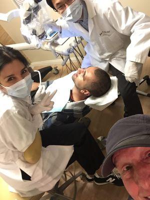 Dr. Chan and Dr. Chan working on my son late into the night for emergency dentistry.