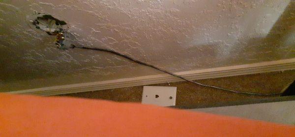 Hole in wall and exposed wires