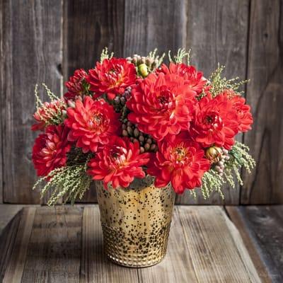 Mono botanical. One flower (in this case- dahlia) accented by seasonal foliage.