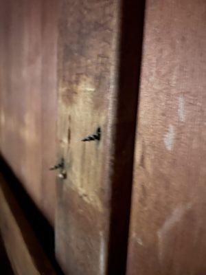 Exposed screws in sauna