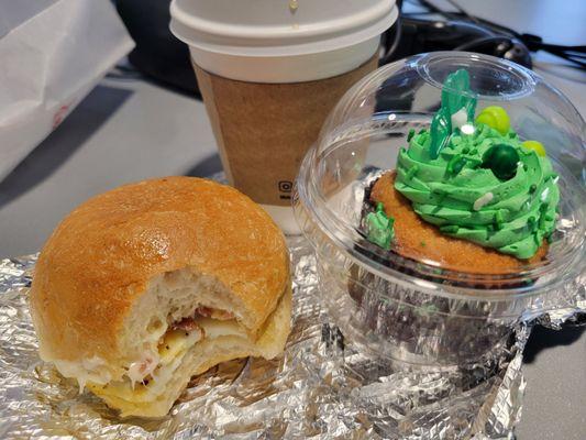 Breakfast sandwich,  Saint paddy's cupcake and coffee