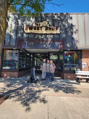 Three different Sweet Shop owners, each of a different time, standing for a picture.